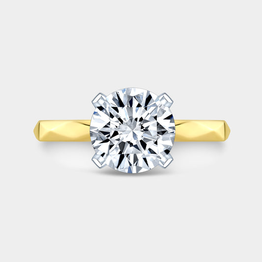 Round ring, top down, faceted band solitaire.