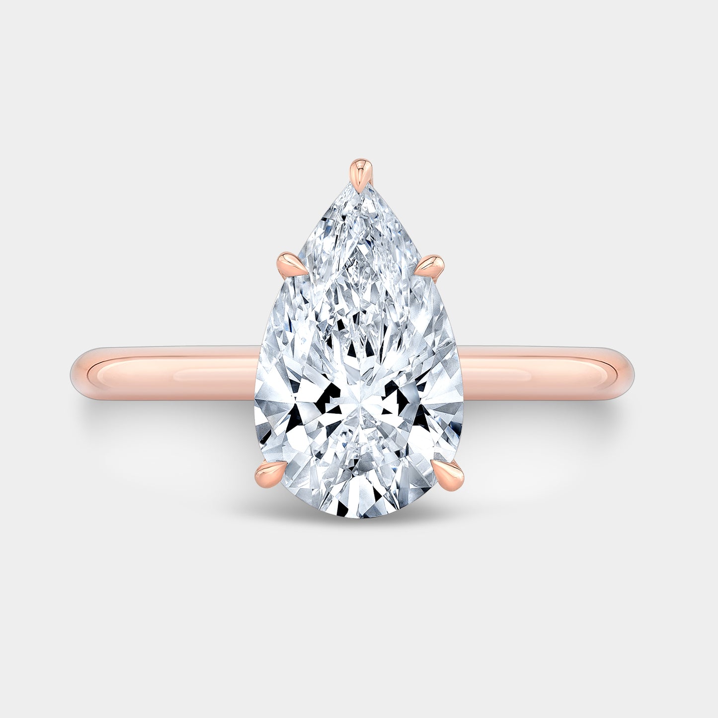 Rose gold pear ring, top view.