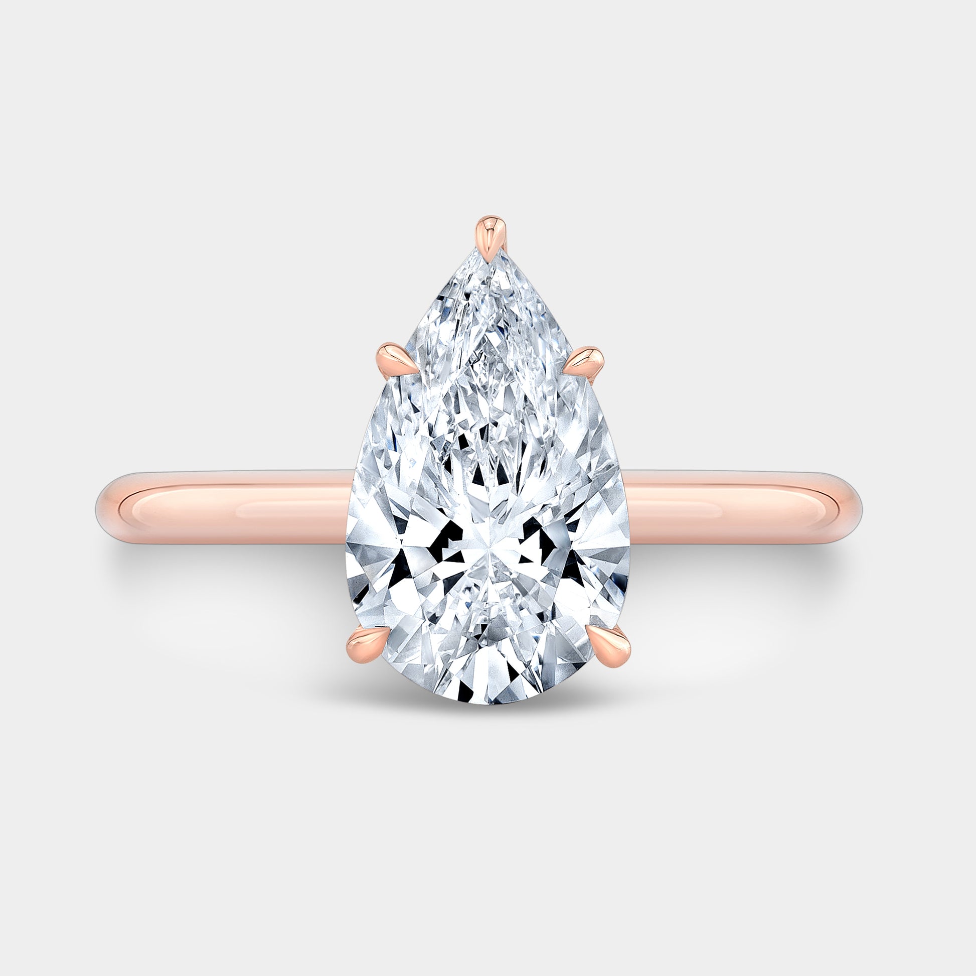 Rose gold pear ring, top view.