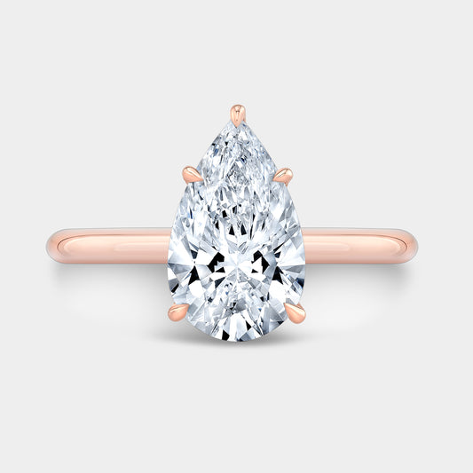 Rose gold pear ring, top view.