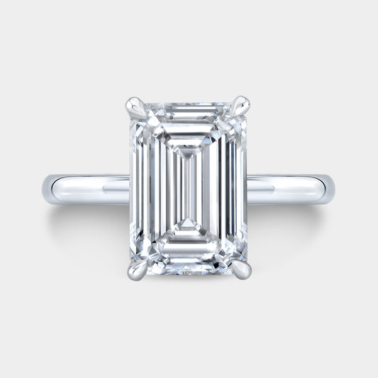 White gold emerald ring, top view, solitaire.