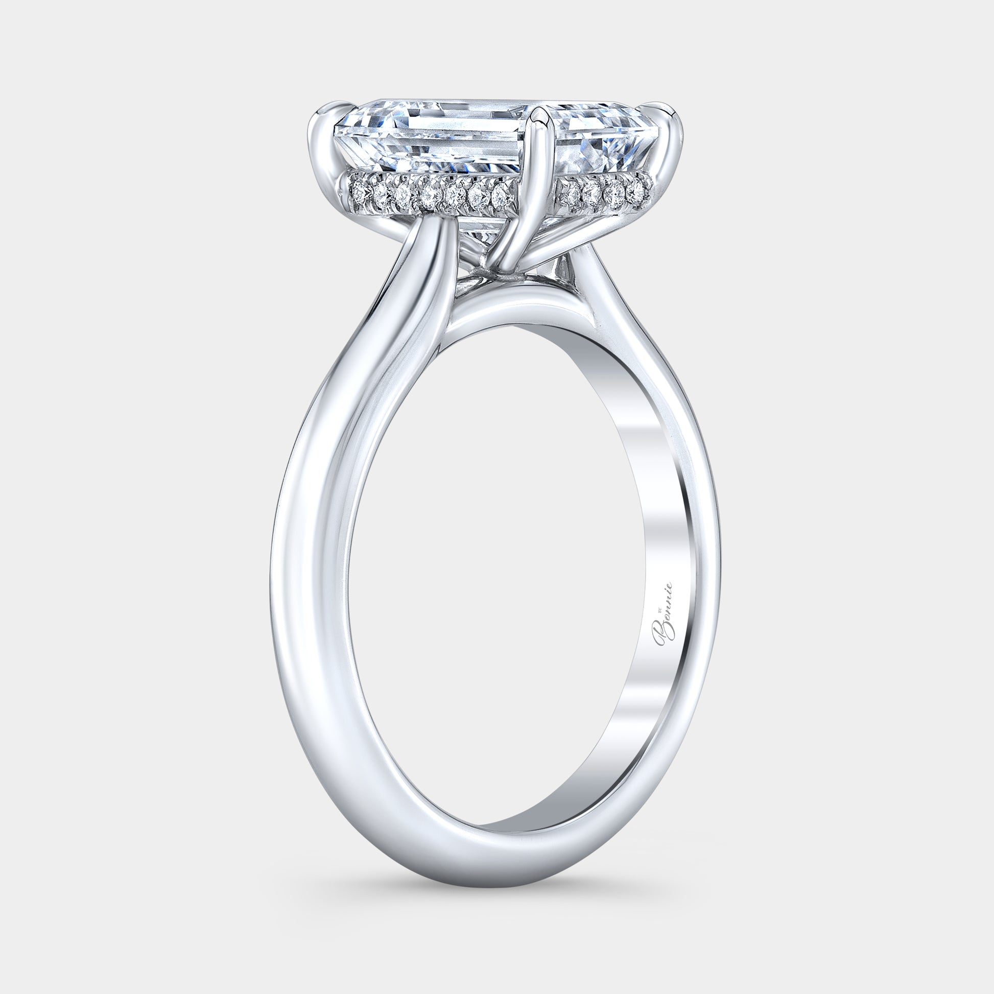 Emerald diamond ring, hidden halo and cathedral view.