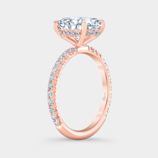 Rose gold diamond ring on hand, oval halo.