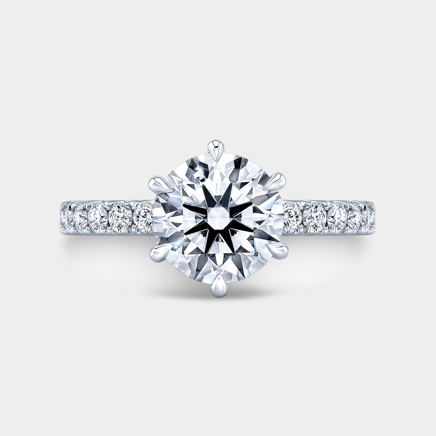 Platinum round diamond ring, top view, pave.