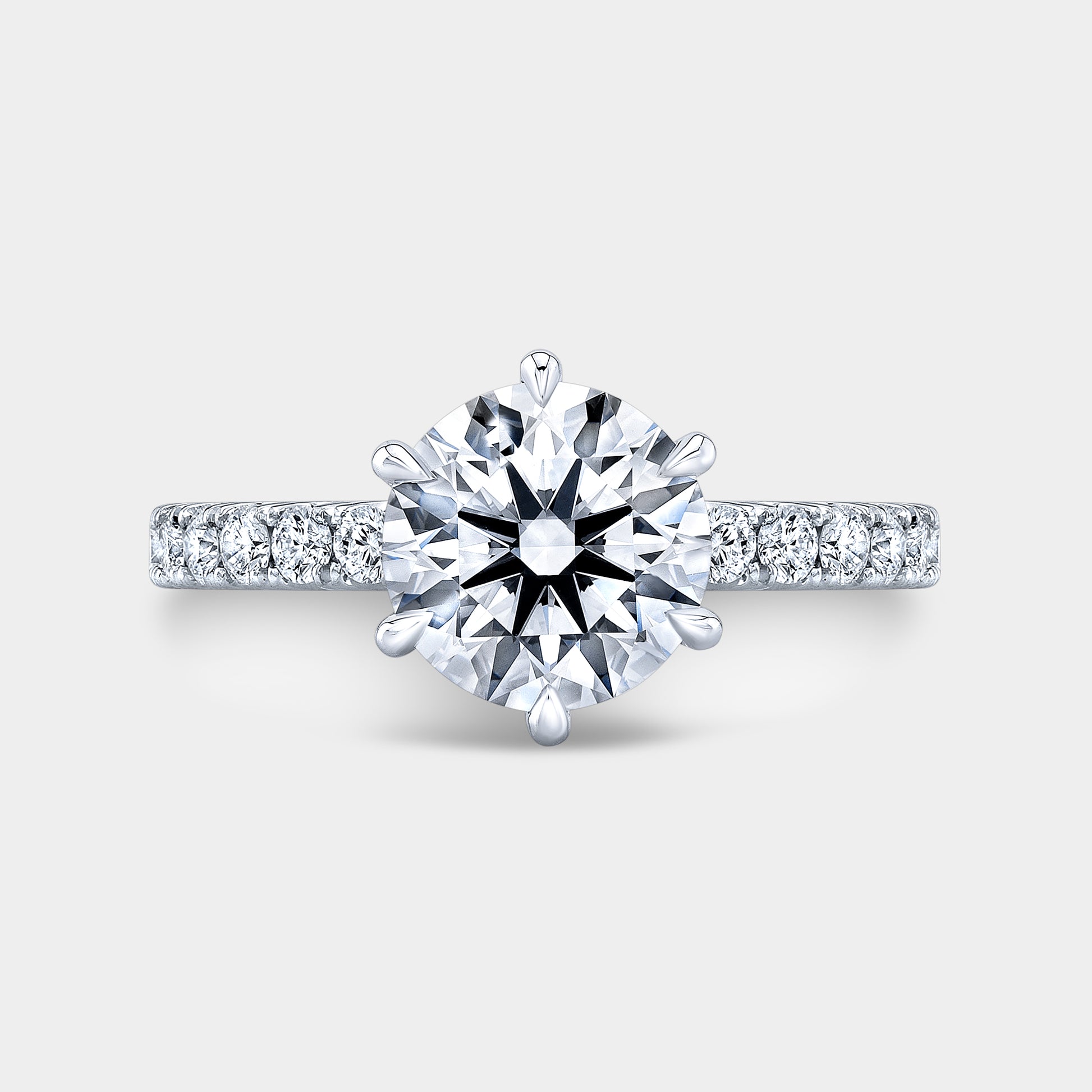 Platinum round diamond ring, top view, pave.