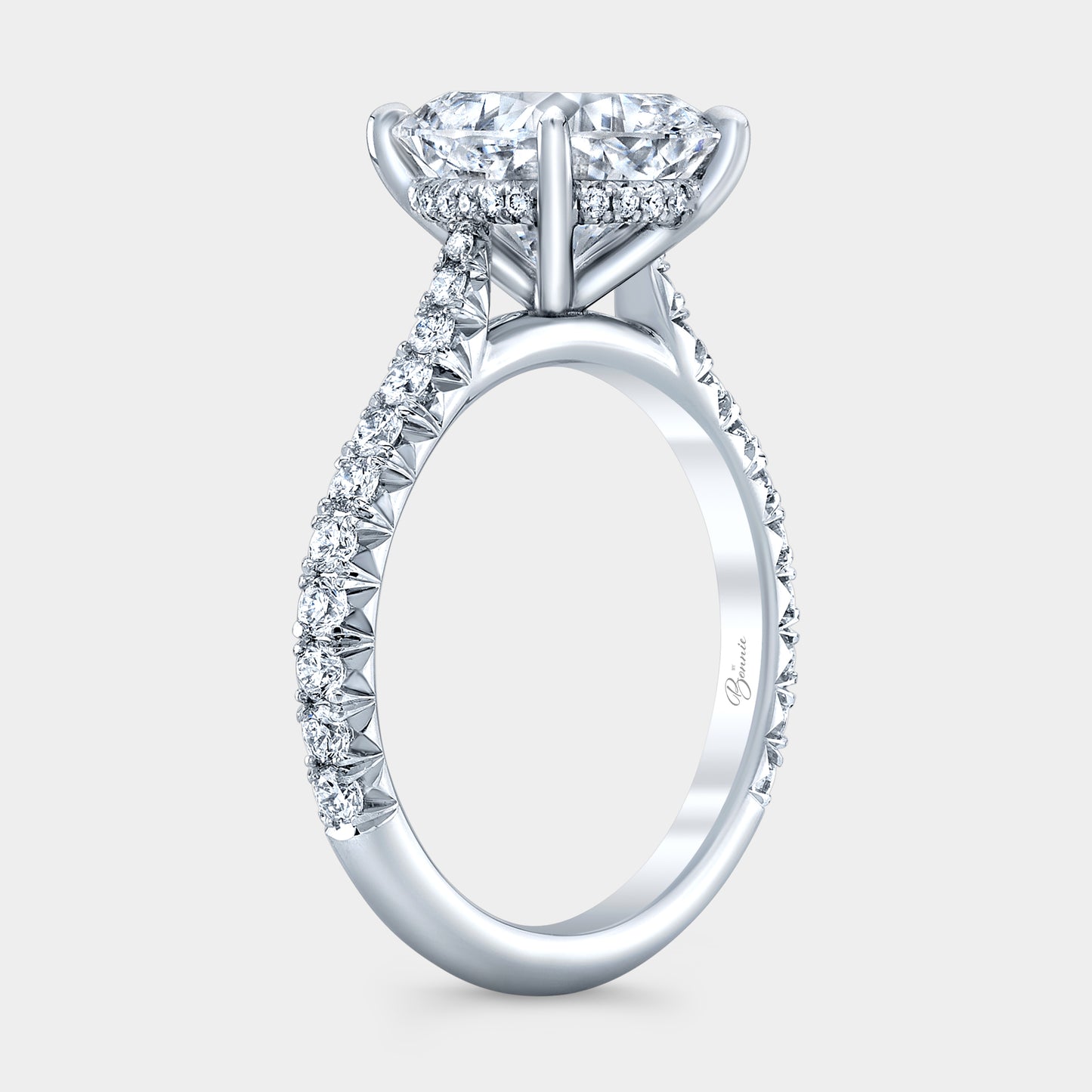 Cushion diamond ring, cathedral halo.