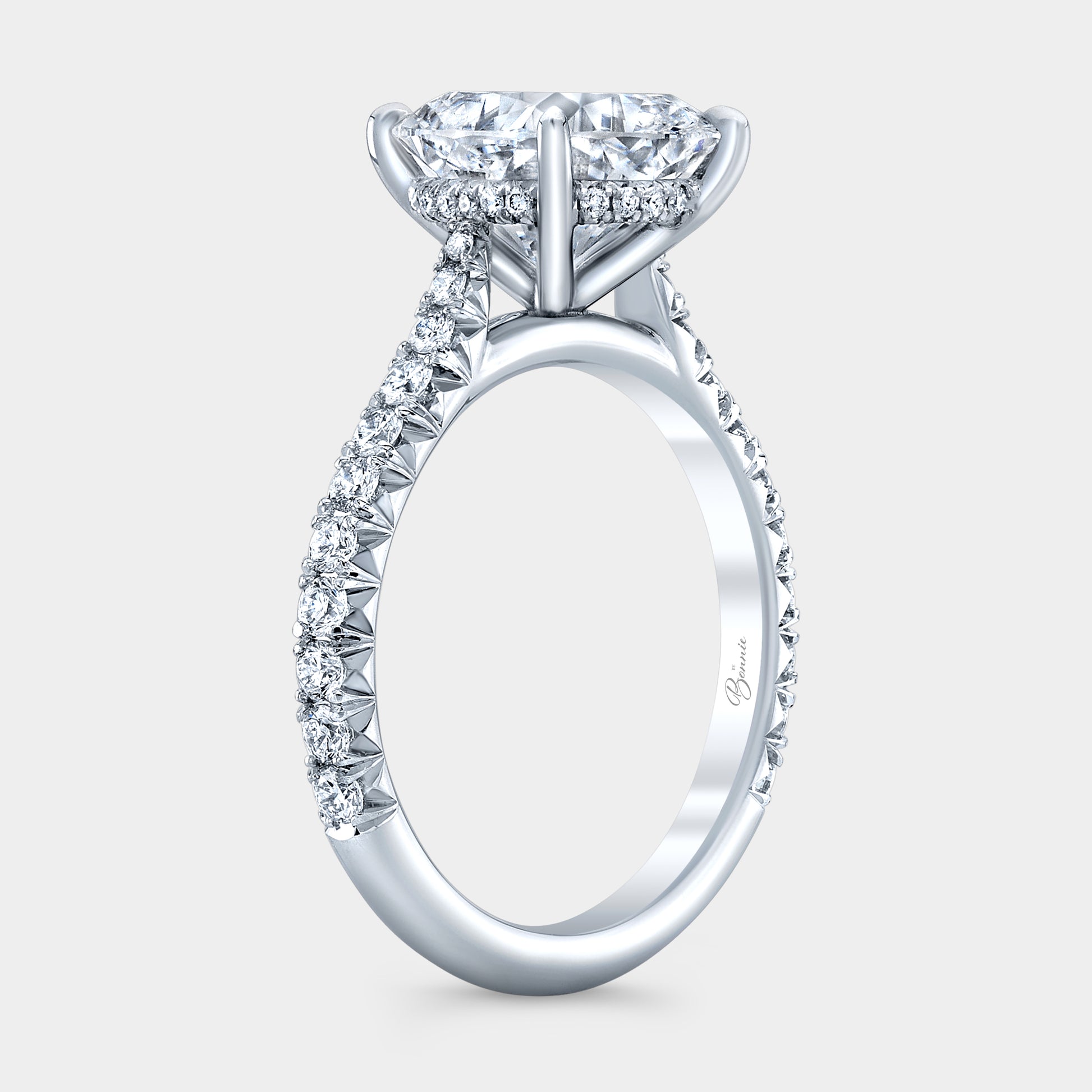Cushion diamond ring, cathedral halo.