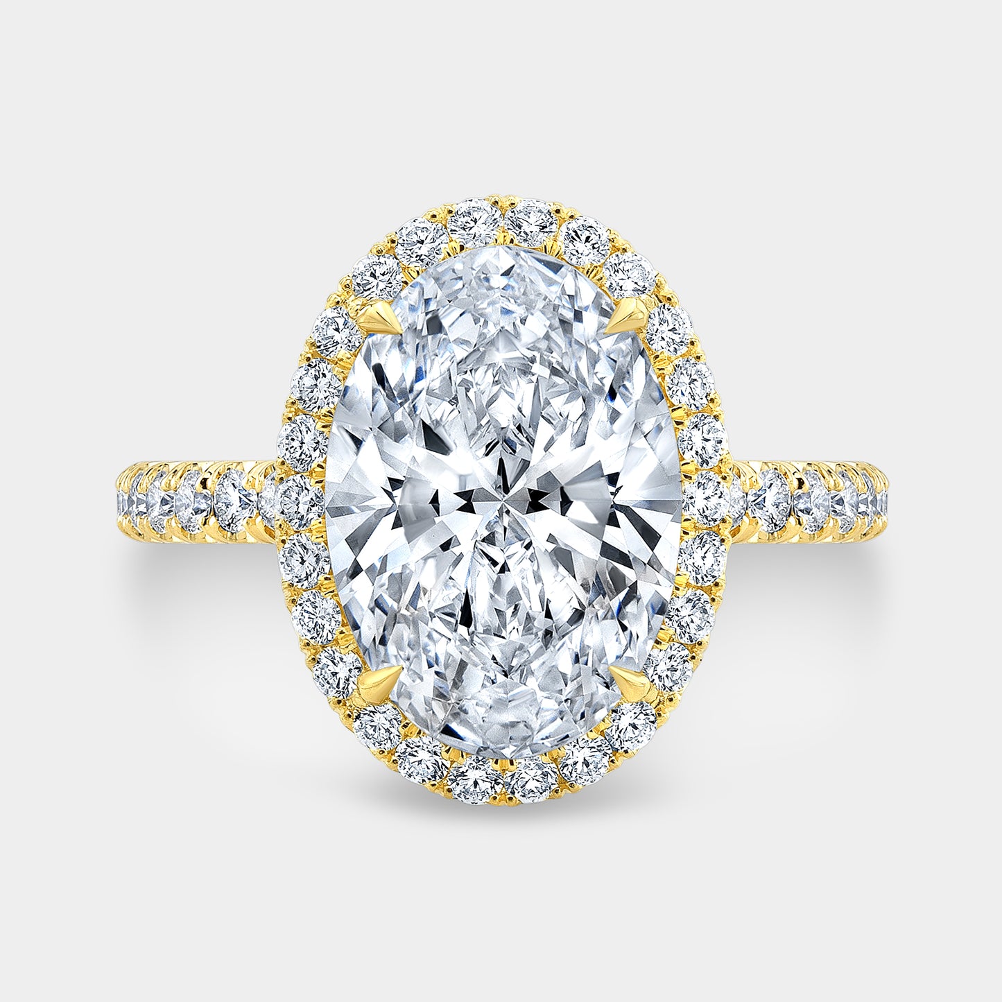 Oval ring, top down, halo, U pave setting.