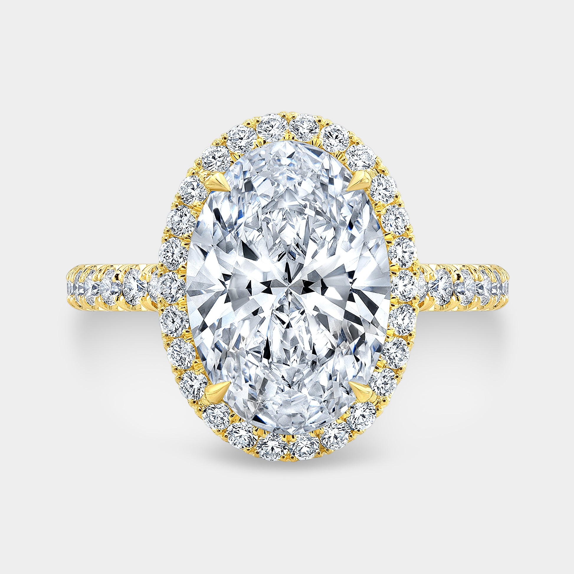 Oval ring, top down, halo, U pave setting.