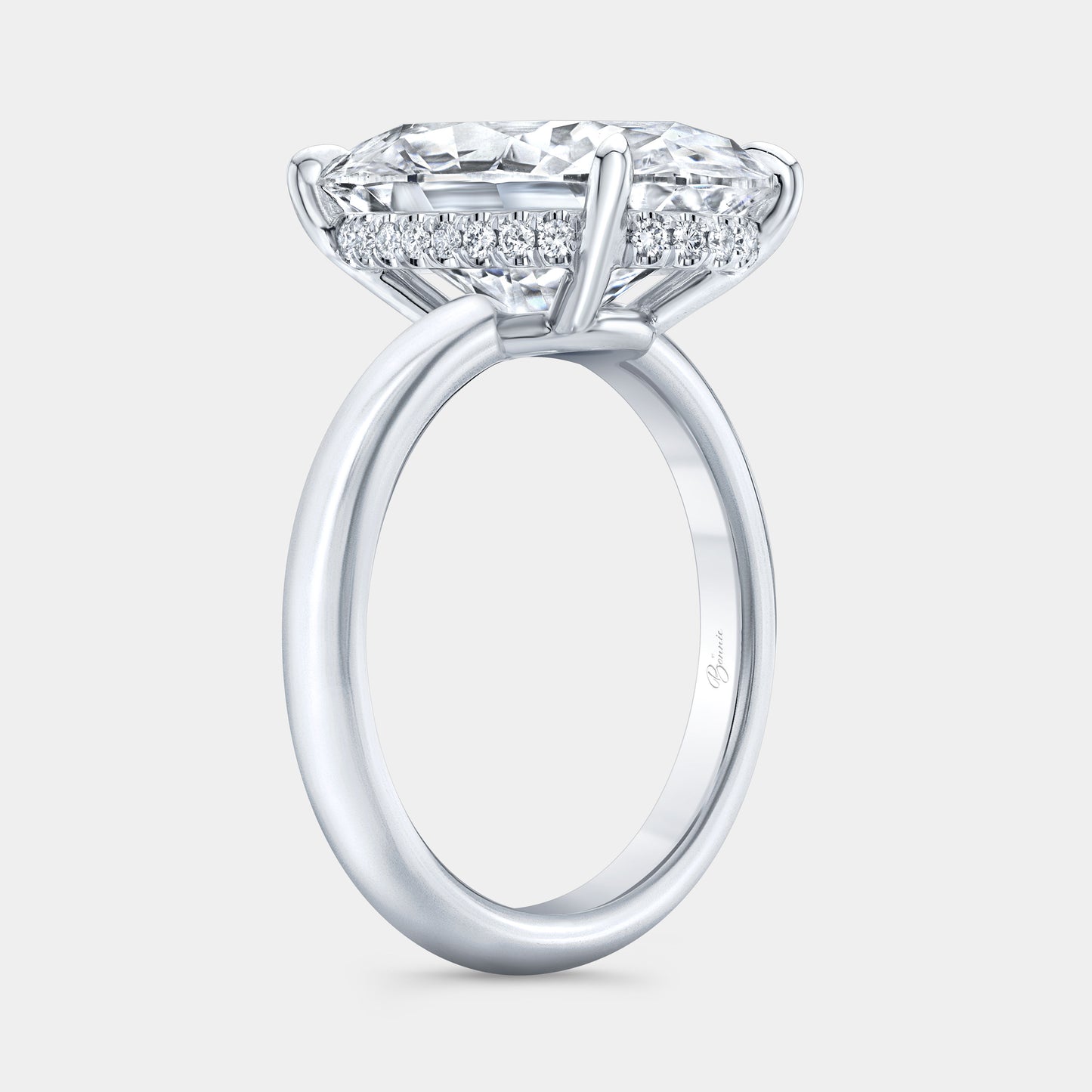 Oval diamond Hailey ring, white gold band, hidden halo.