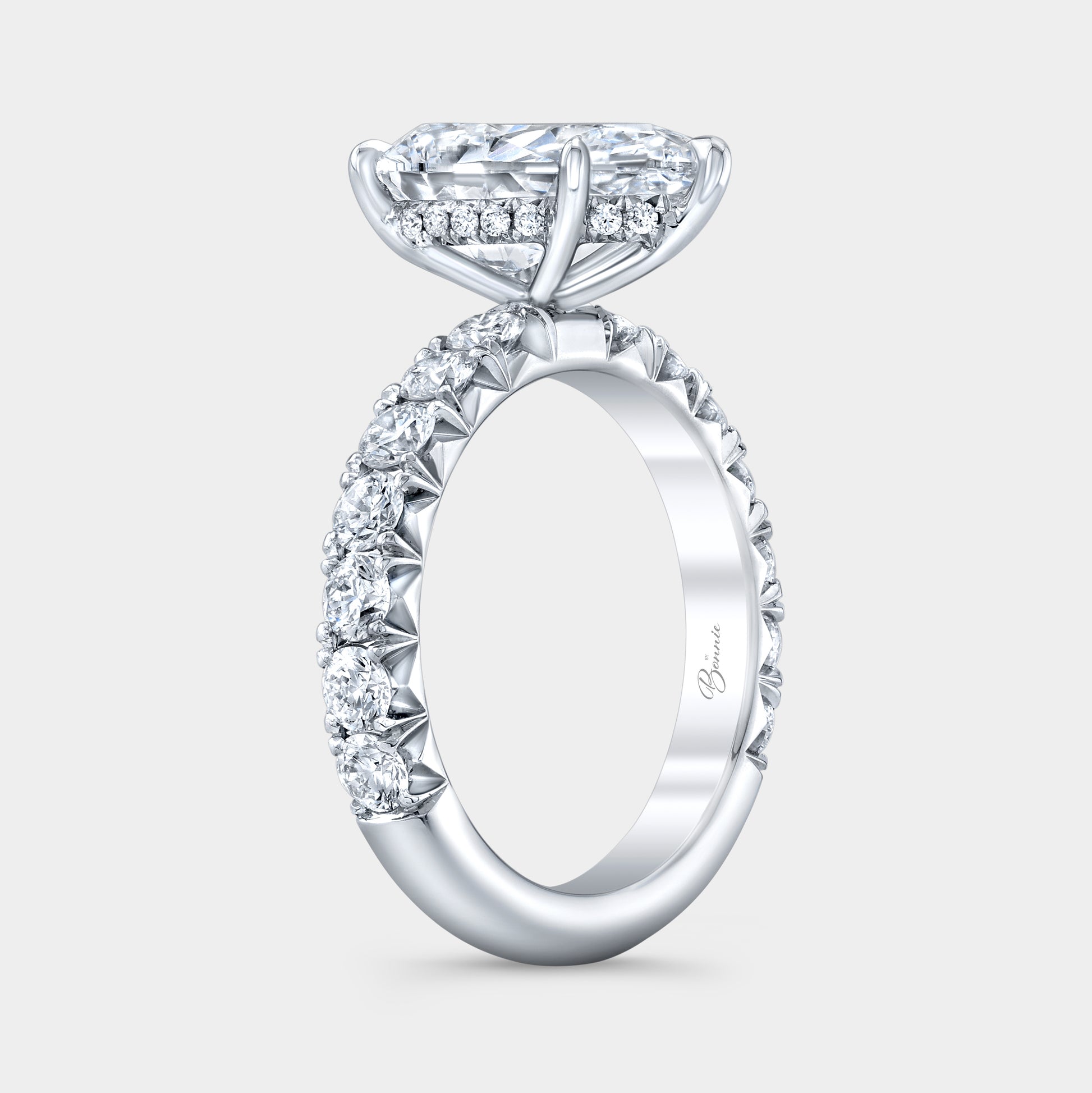 Pear diamond ring, hidden halo setting.