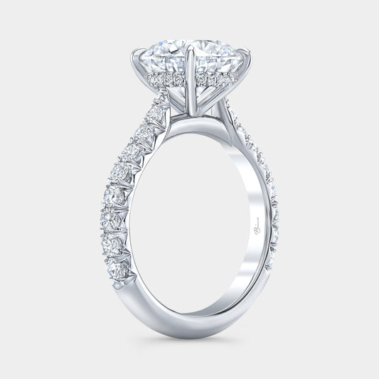 Round diamond halo ring, white gold band, French pave.