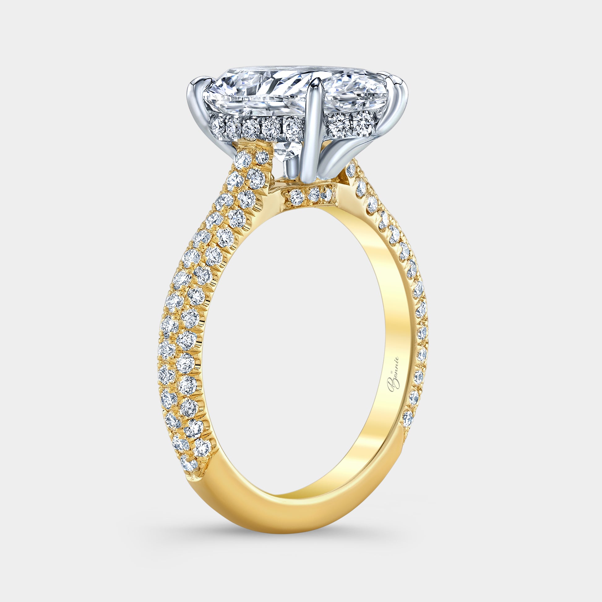 Two tone pear diamond ring, 45 degree, hidden halo.