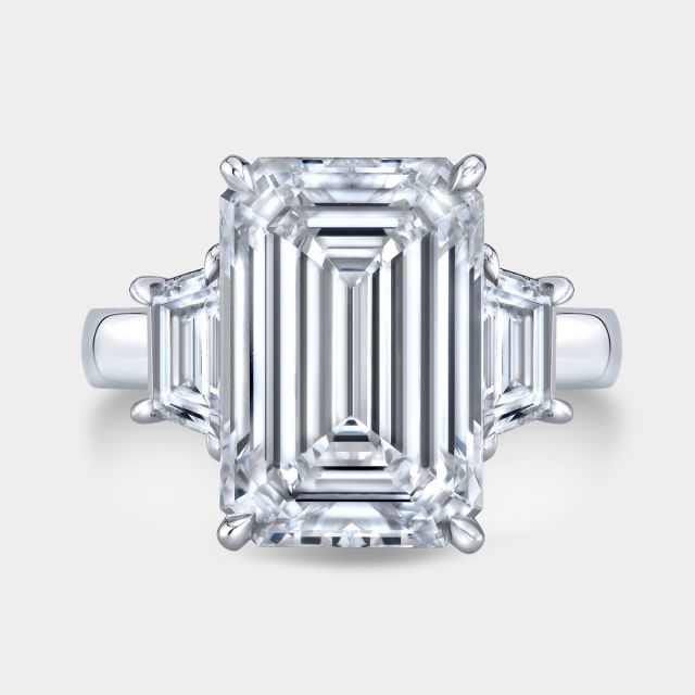 Platinum emerald diamond ring, top view, trapezoid sides.