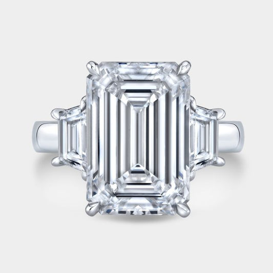 Platinum emerald diamond ring, top view, trapezoid sides.