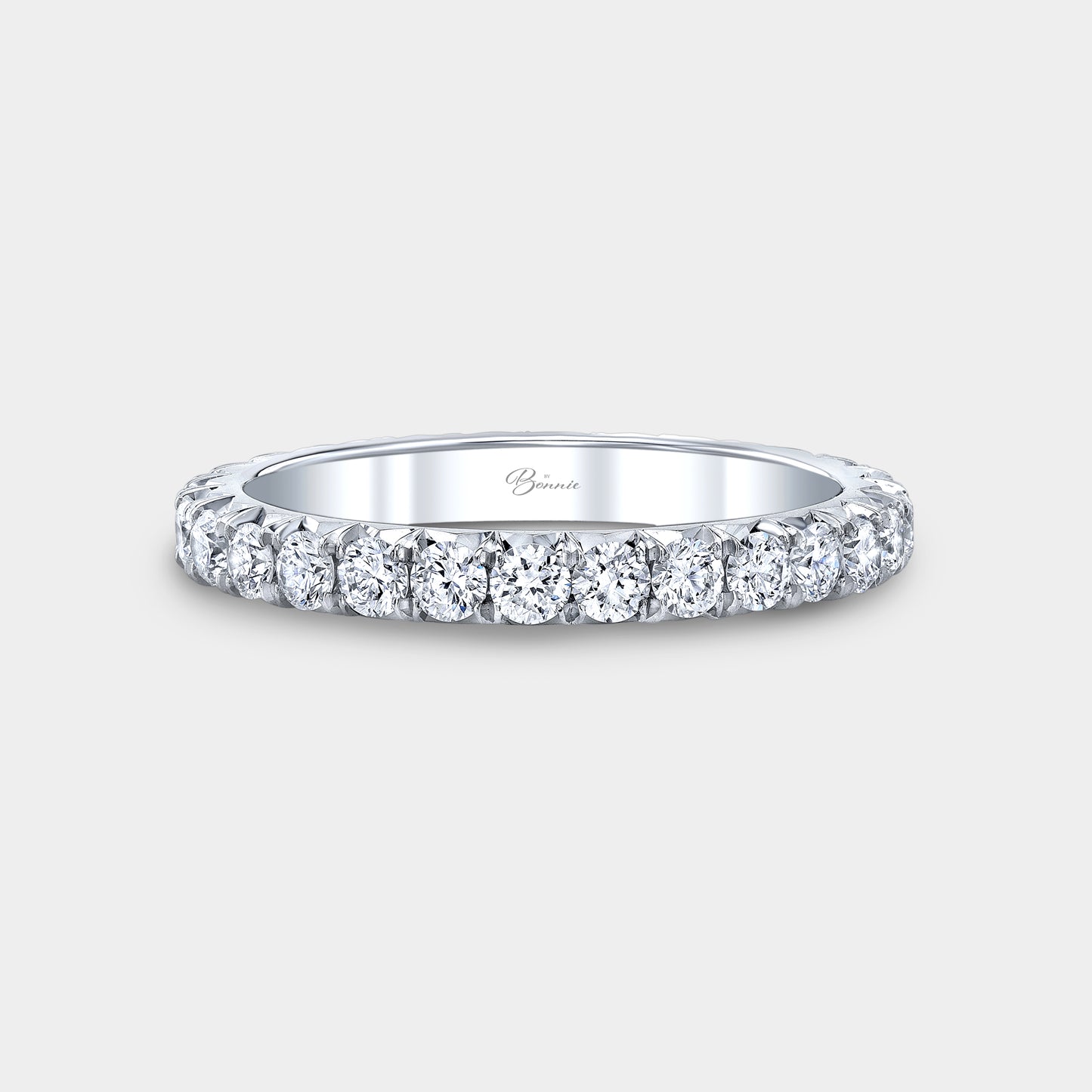 Platinum French pave diamond eternity band.