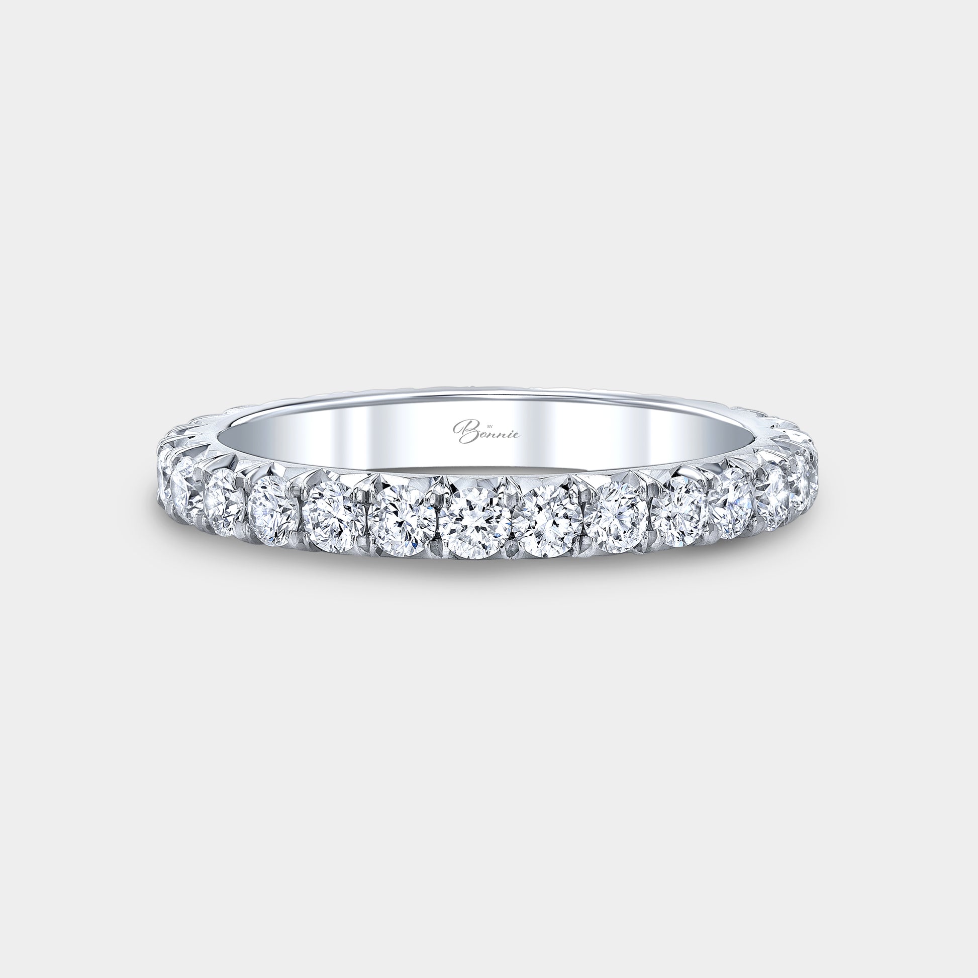 Platinum French pave diamond eternity band.
