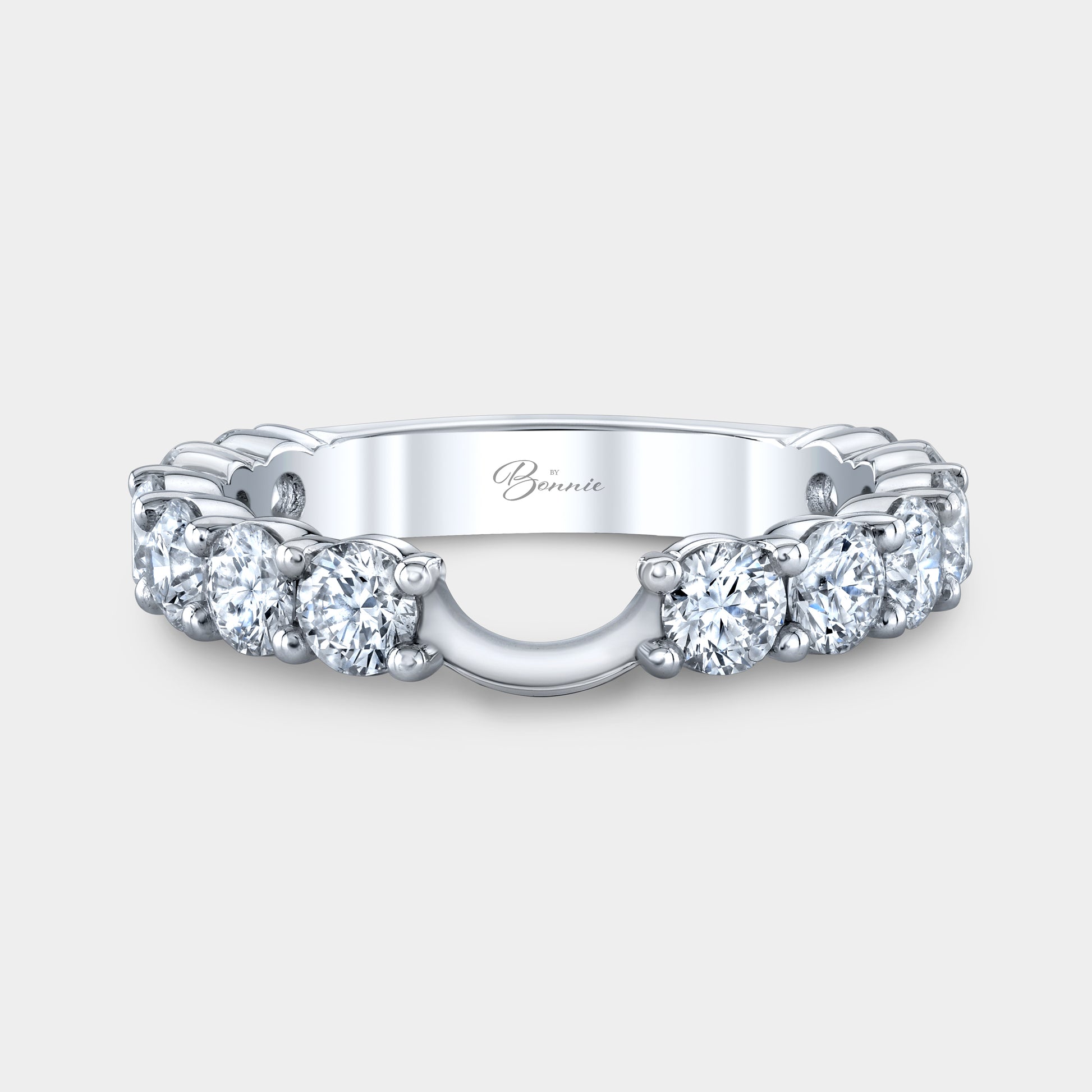 Platinum Sophia contour diamond band, shared prong.