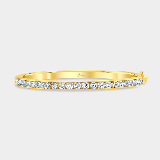 Yellow gold bangle with round lab grown diamonds, channel setting.