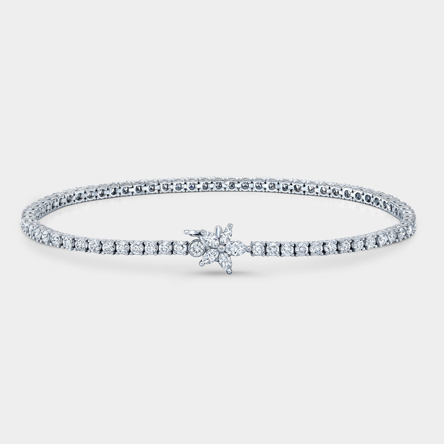 White gold tennis bracelet, marquise and round diamonds.