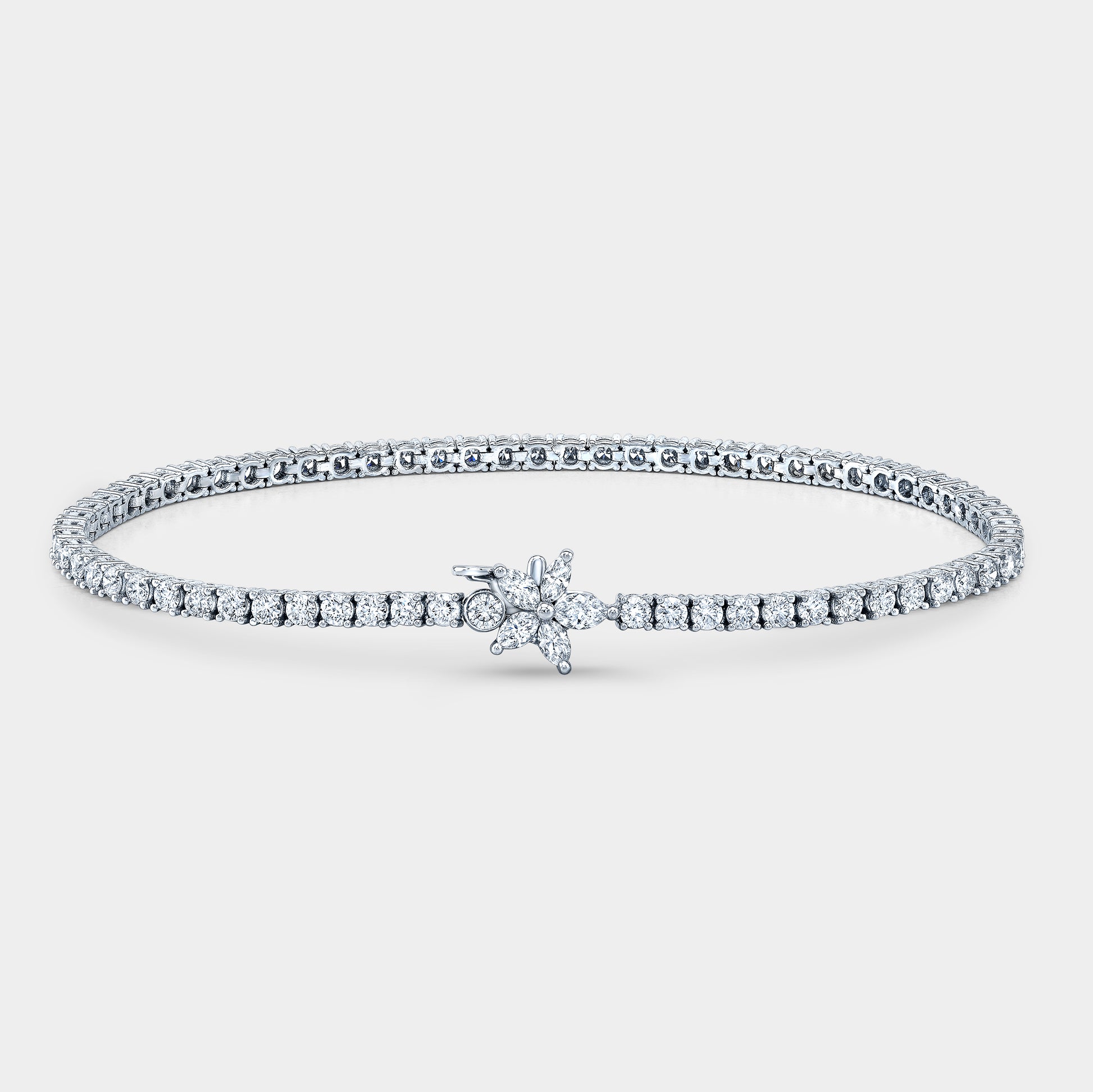 White gold tennis bracelet, marquise and round diamonds.
