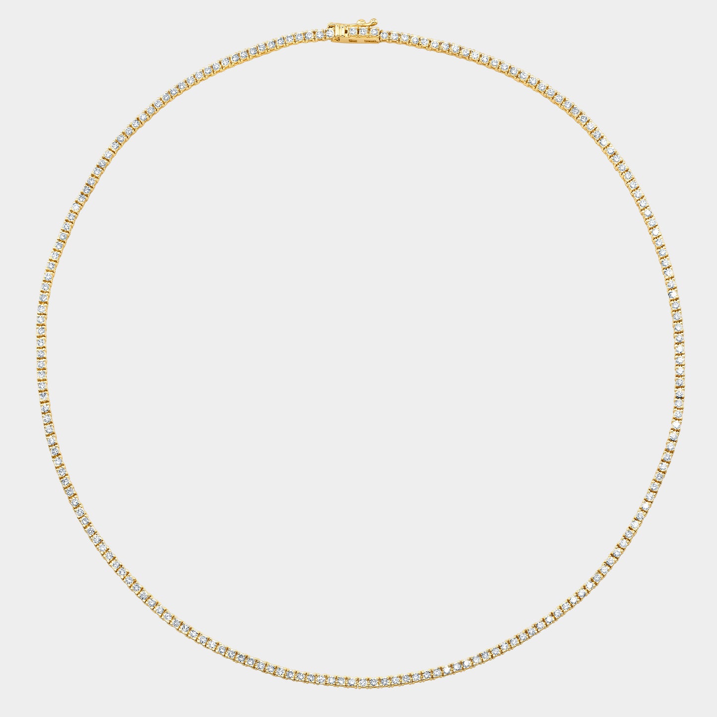 Yellow gold tennis necklace, round natural diamonds.