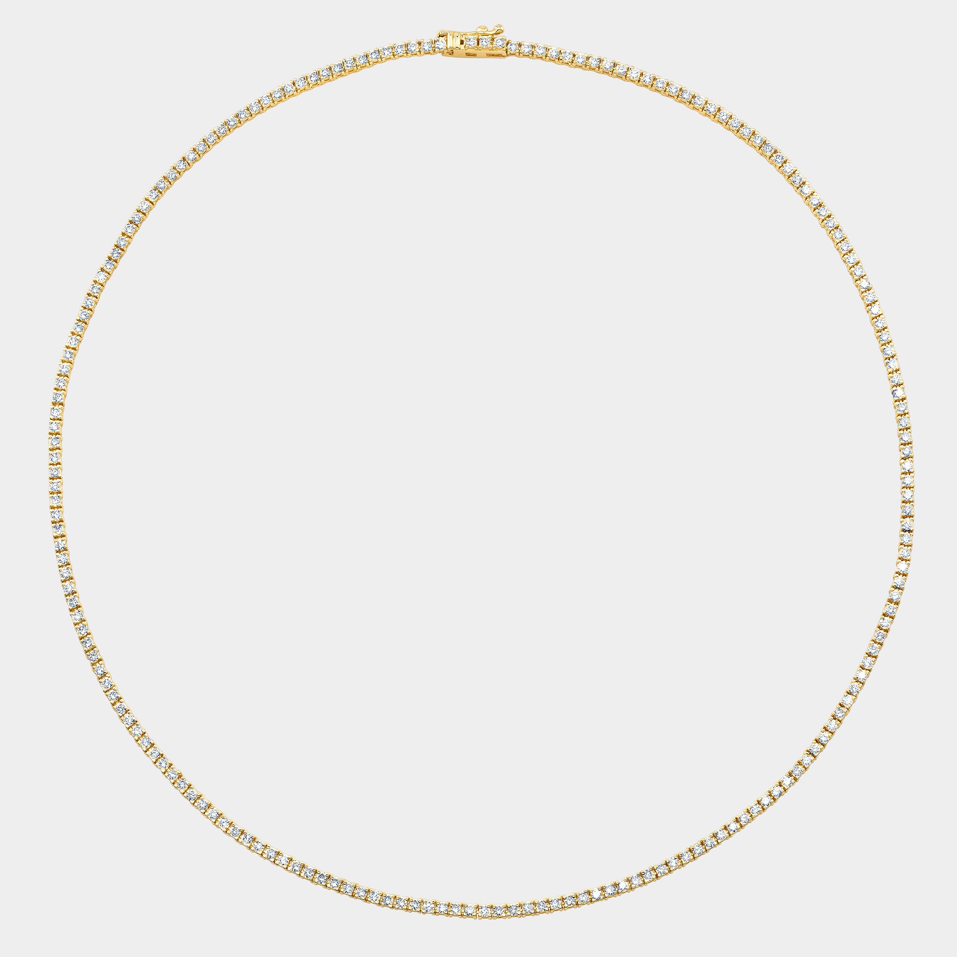 Yellow gold tennis necklace, round natural diamonds.
