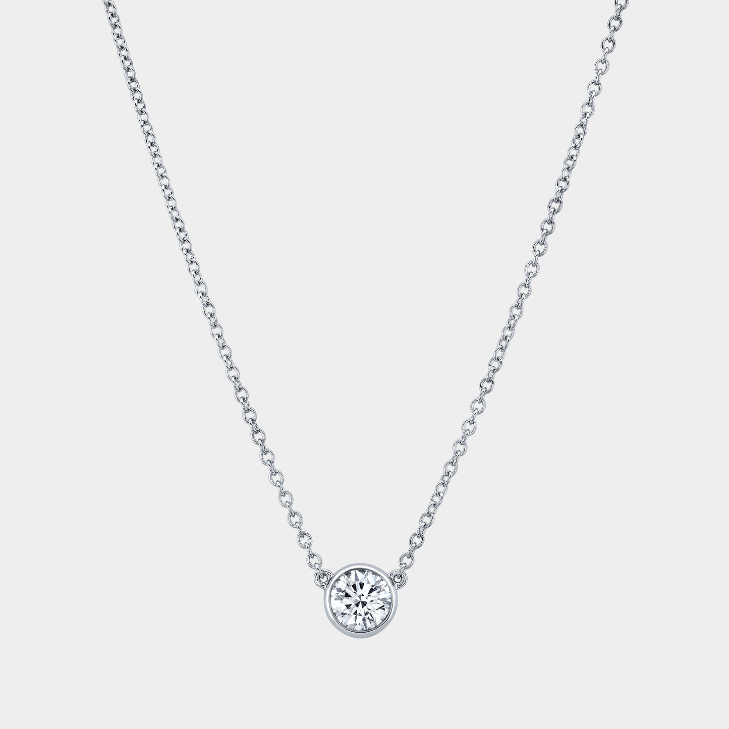 Platinum necklace, round diamond pendant, bezel setting.