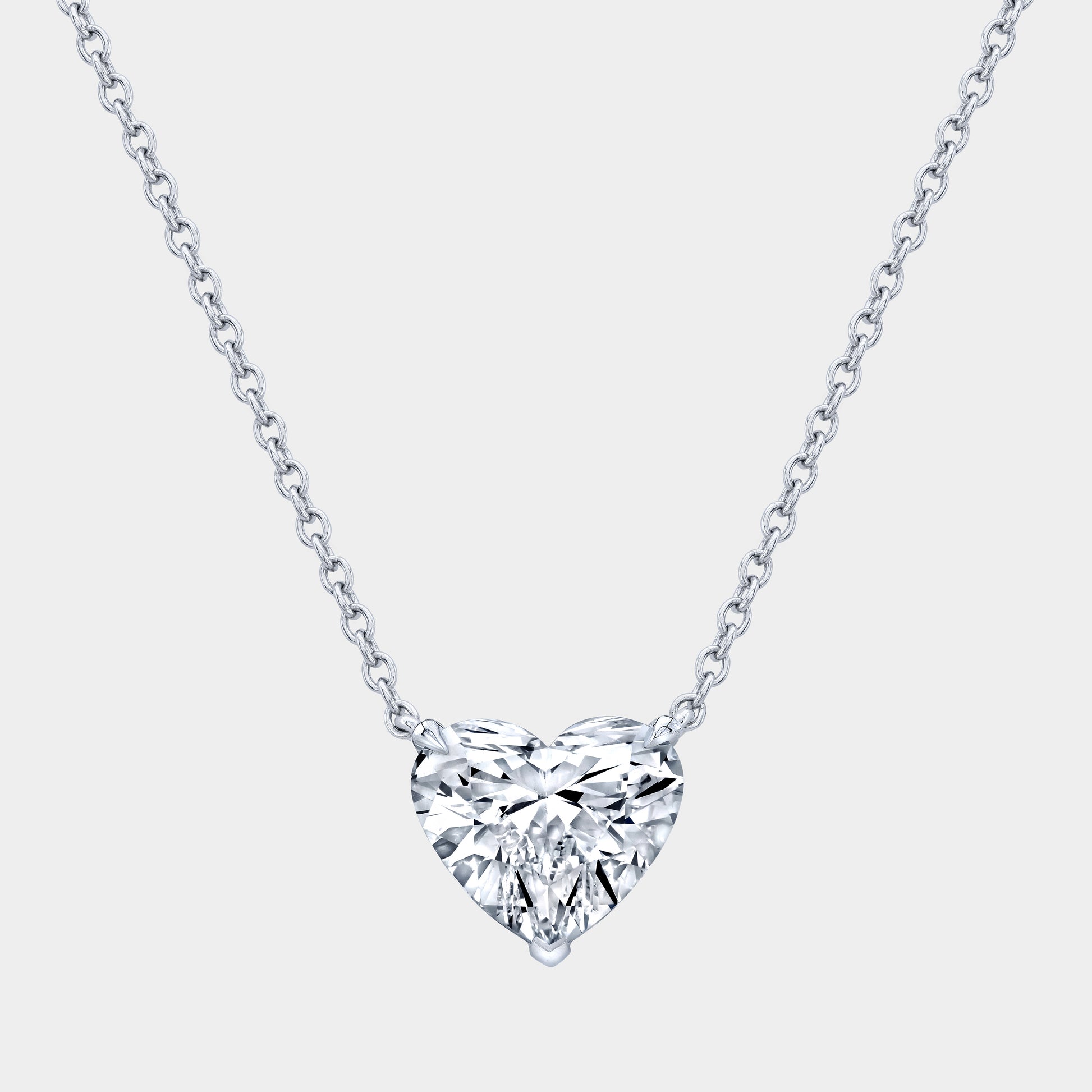 Platinum necklace, heart diamond pendant, solitaire setting.
