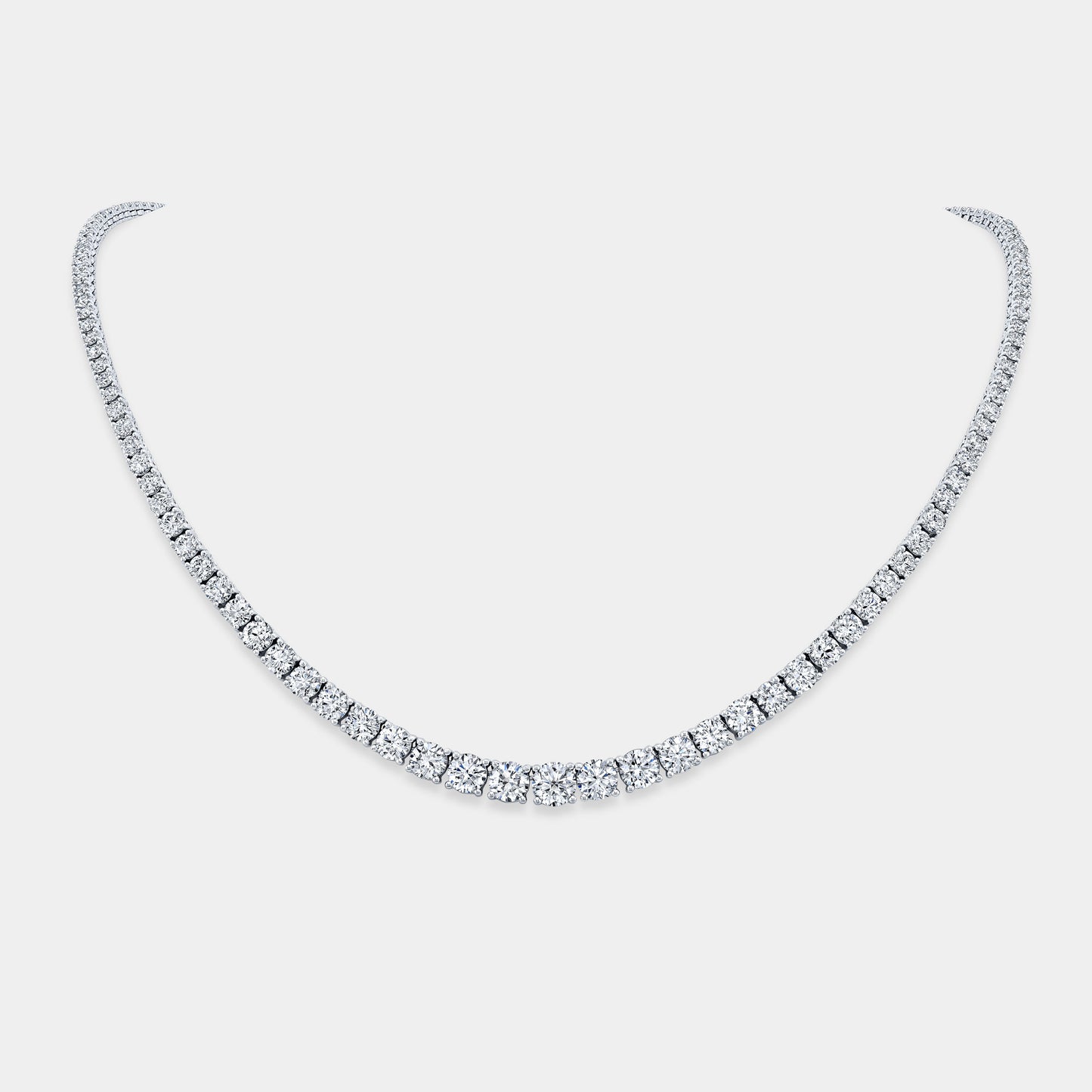 Necklace worn on person, round lab grown diamonds, graduating design.