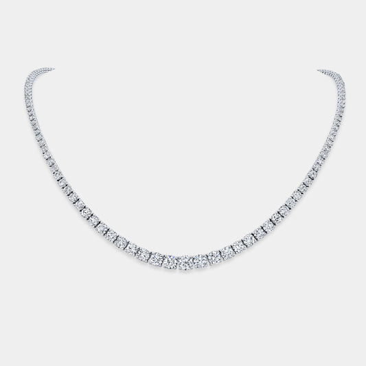 Necklace worn on person, round lab grown diamonds, graduating design.