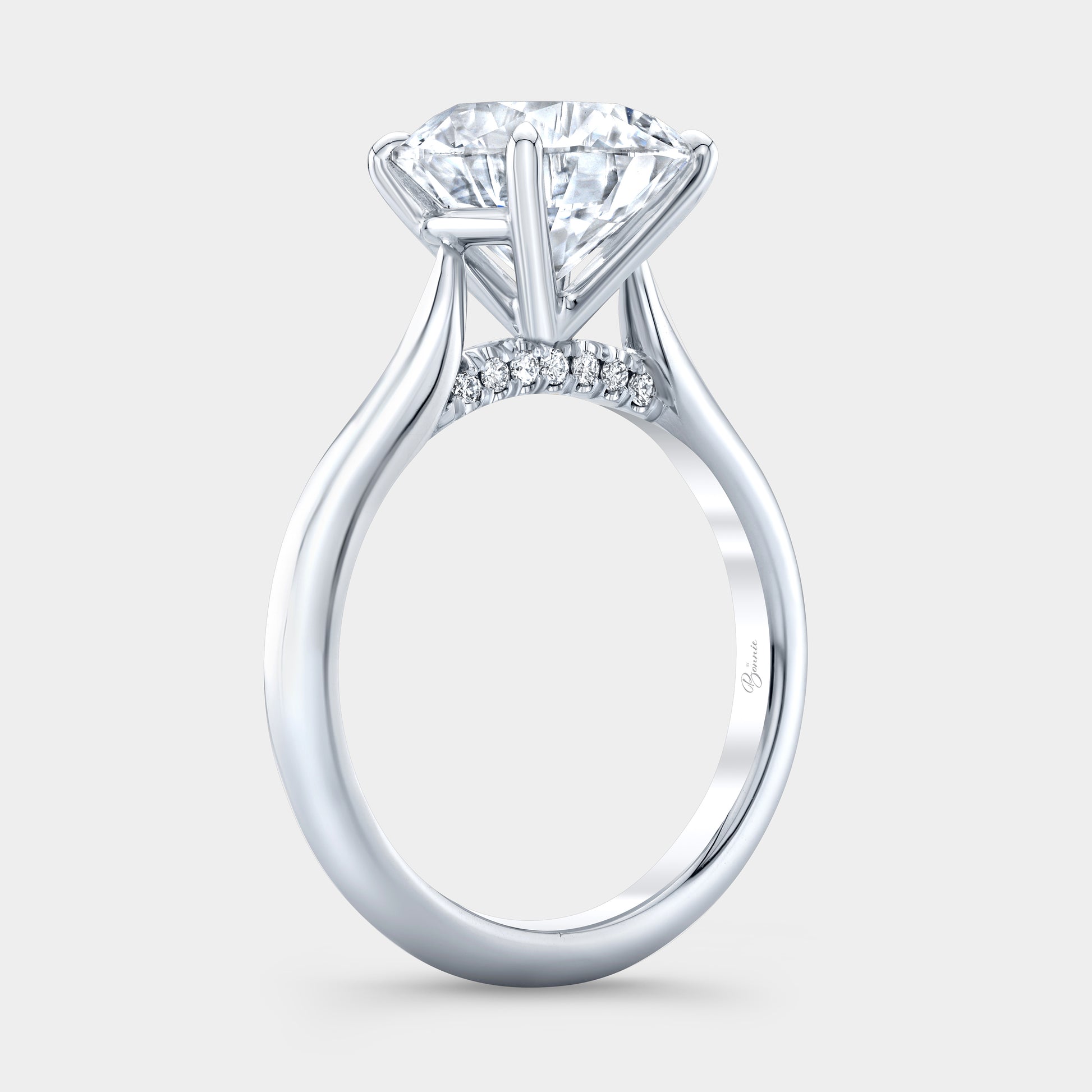 Round diamond solitaire ring, white gold band.