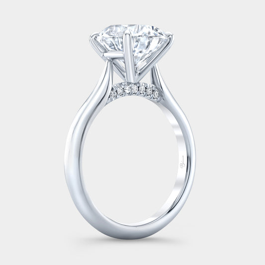 Round diamond solitaire ring, white gold band.