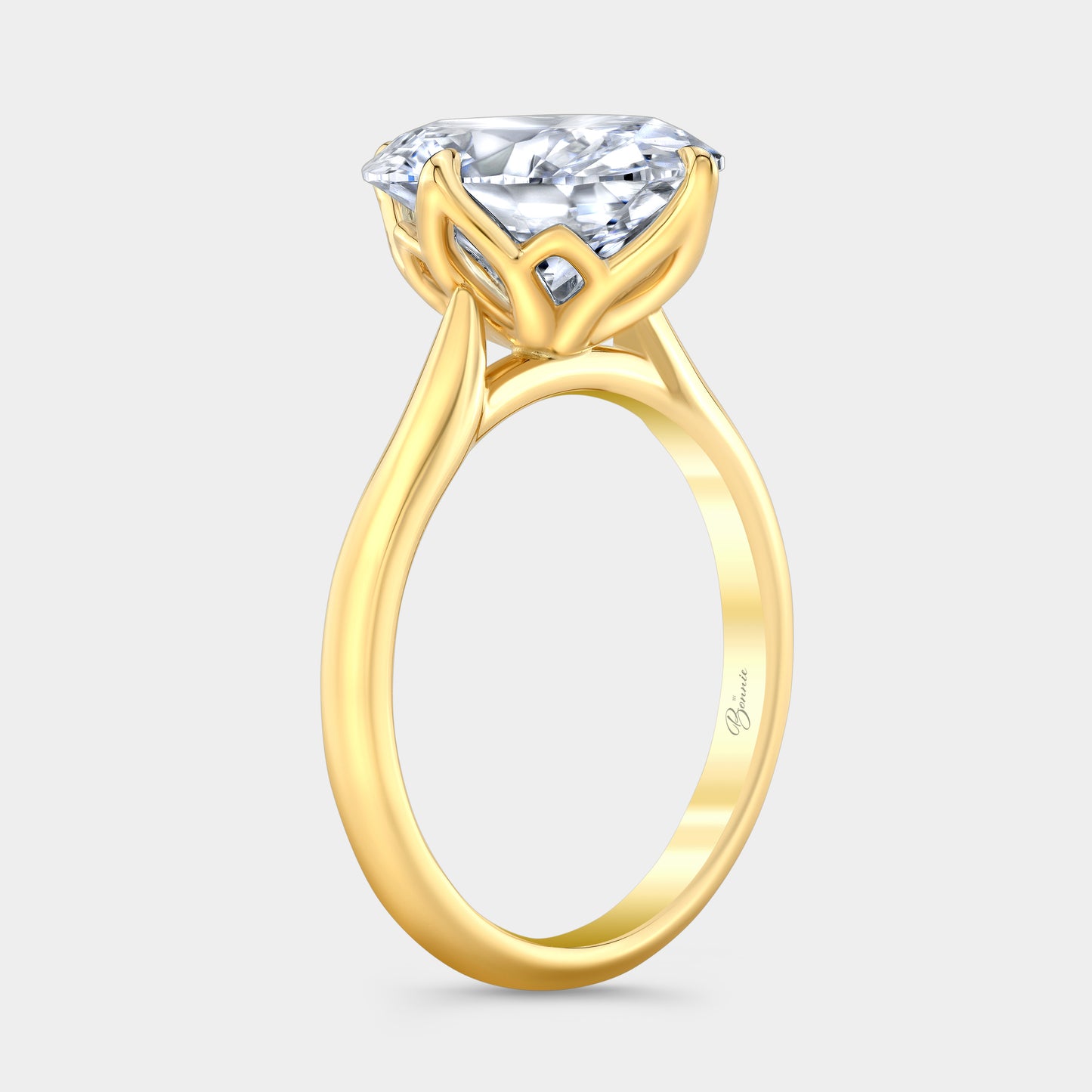 Yellow gold diamond ring on hand, oval tulip.