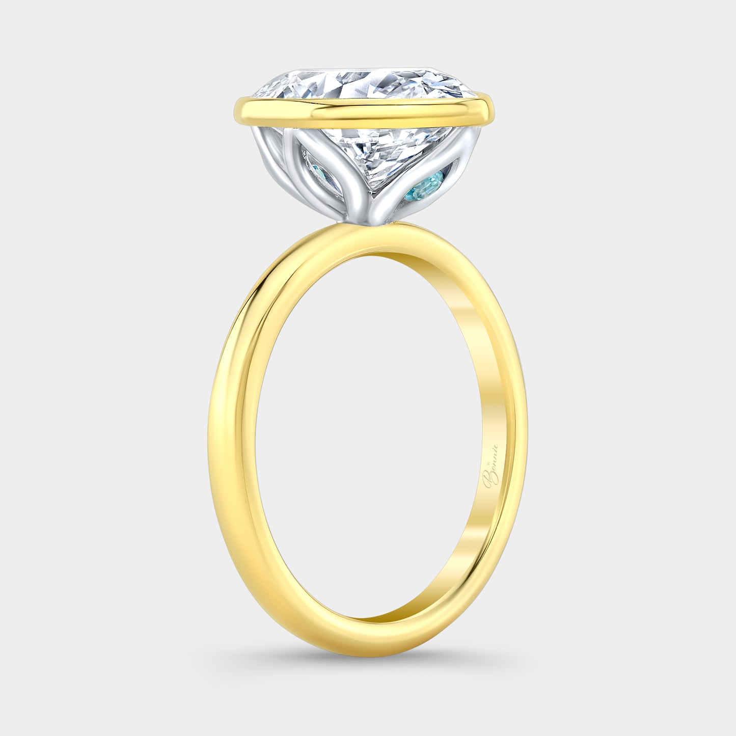 Two tone diamond ring on hand, oval bezel tulip.