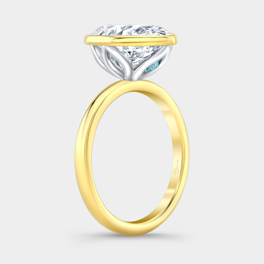 Two tone diamond ring on hand, oval bezel tulip.