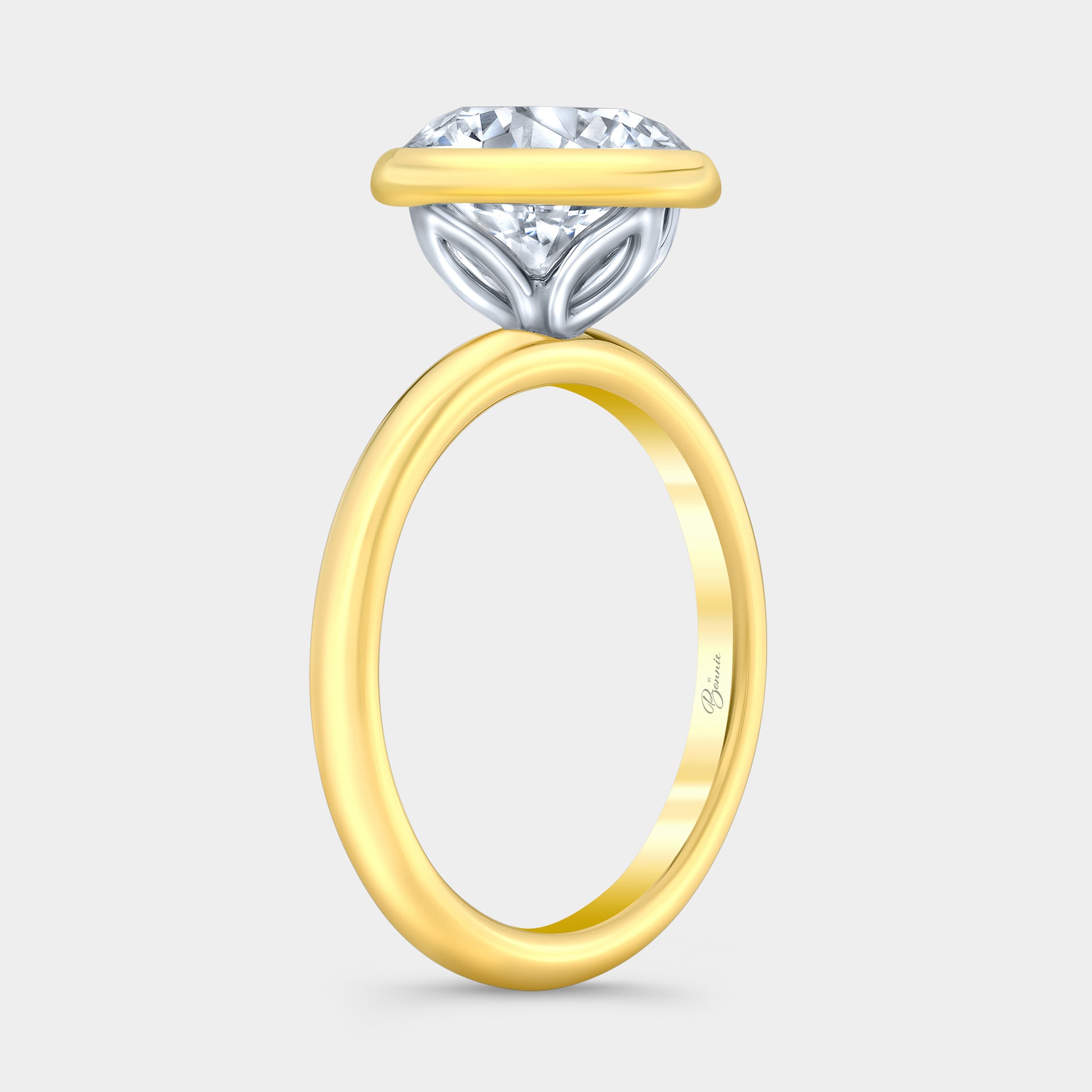 Two tone diamond ring on hand, round tulip.