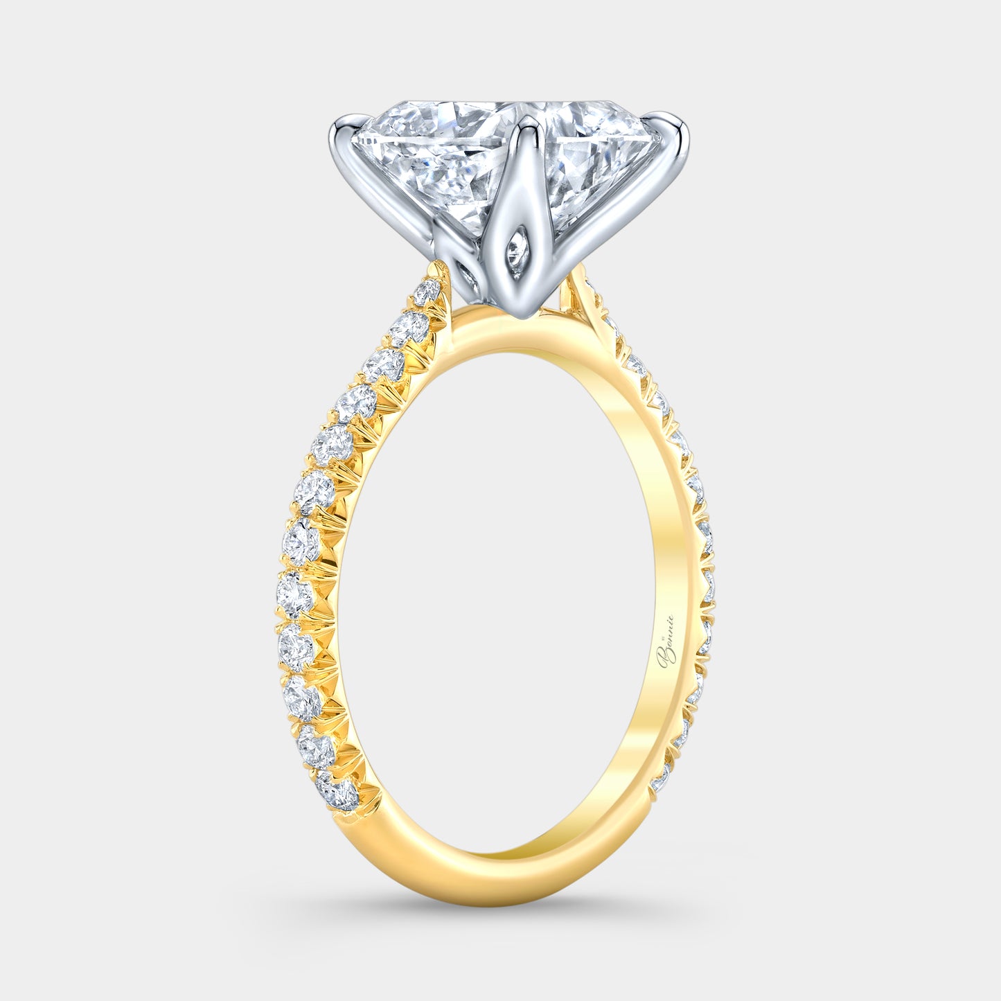 Two tone diamond ring on hand, cushion tulip pave.