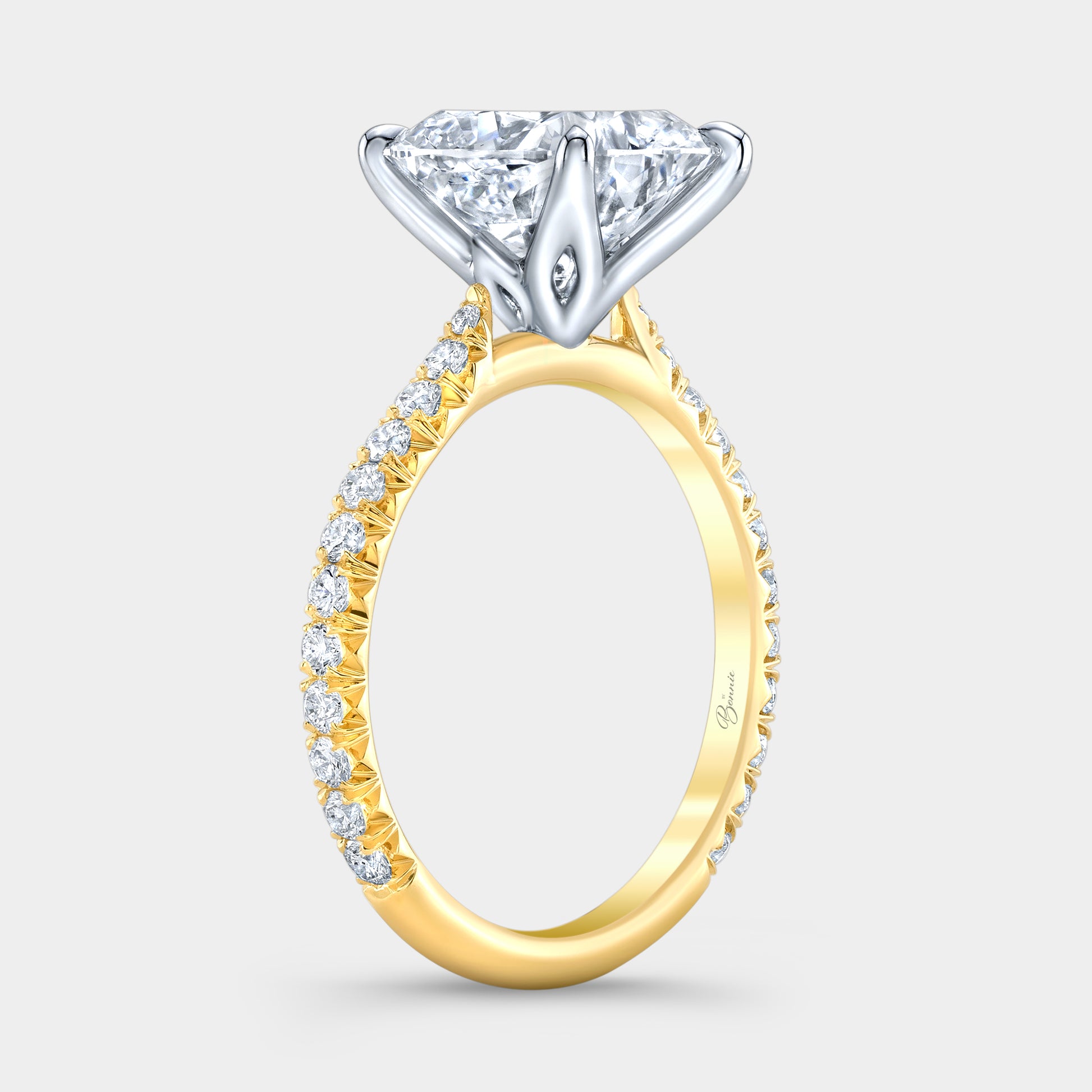 Two tone diamond ring on hand, cushion tulip pave.