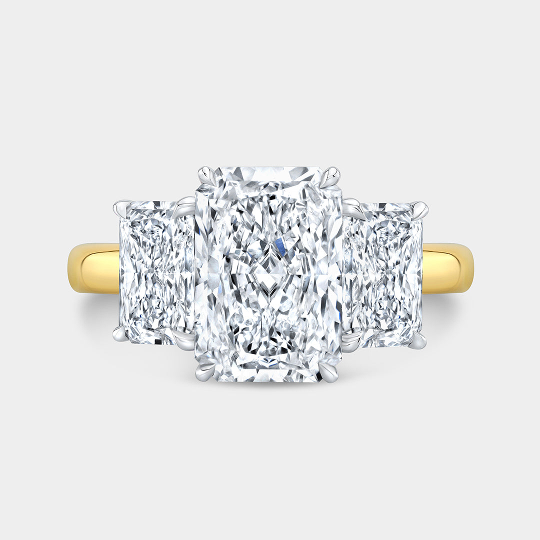 Radiant diamond 3 stone ring, yellow gold.
