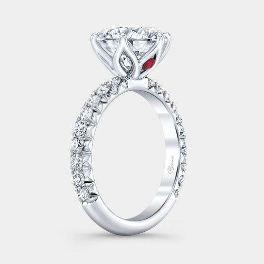 Platinum diamond ring on hand, round tulip pave.