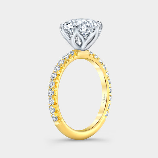 Two tone diamond ring on hand, round tulip pave.
