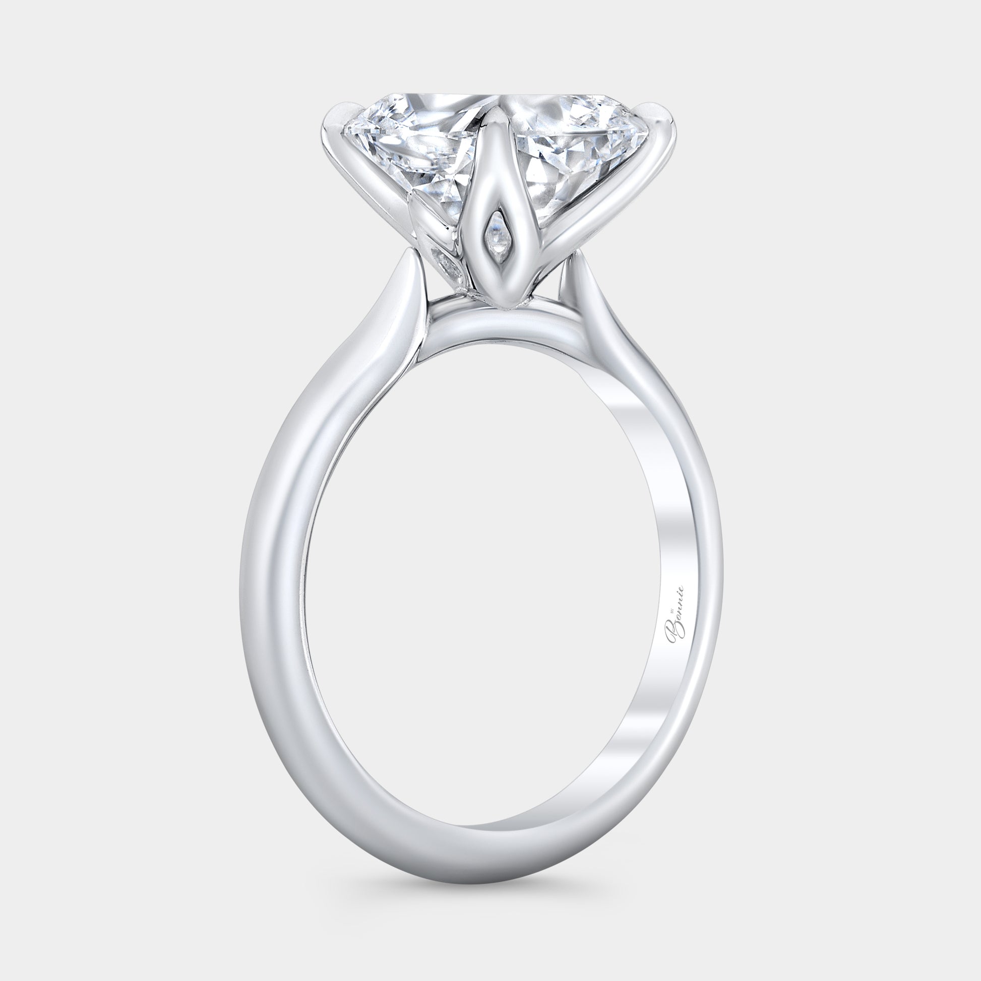 Cushion diamond ring, tulip cathedral setting, knife edge band.