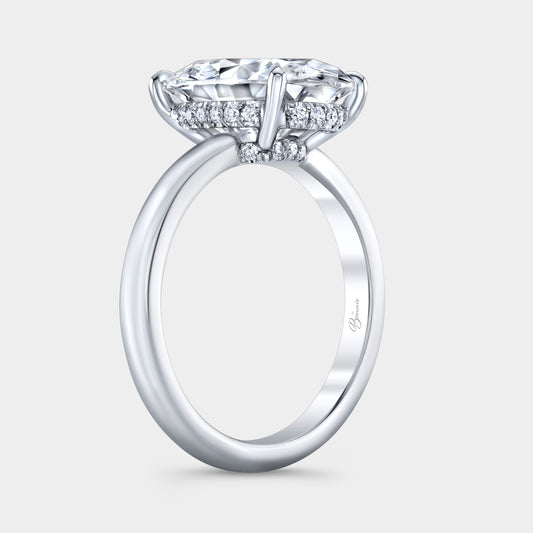 Platinum diamond ring on hand, oval halo.