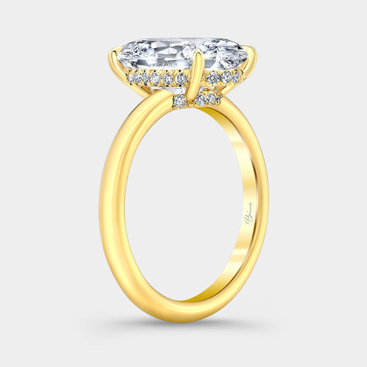 Yellow gold diamond ring on hand, oval halo.