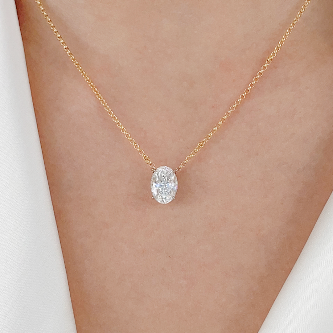 Diamond pendant necklace, worn view.