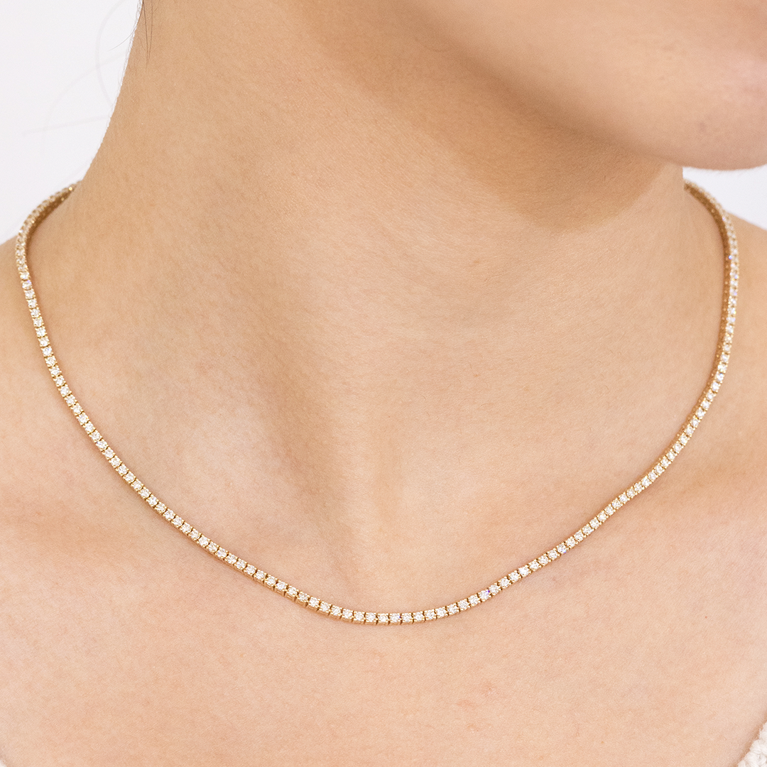 Choker worn on person, round diamonds, petite design.