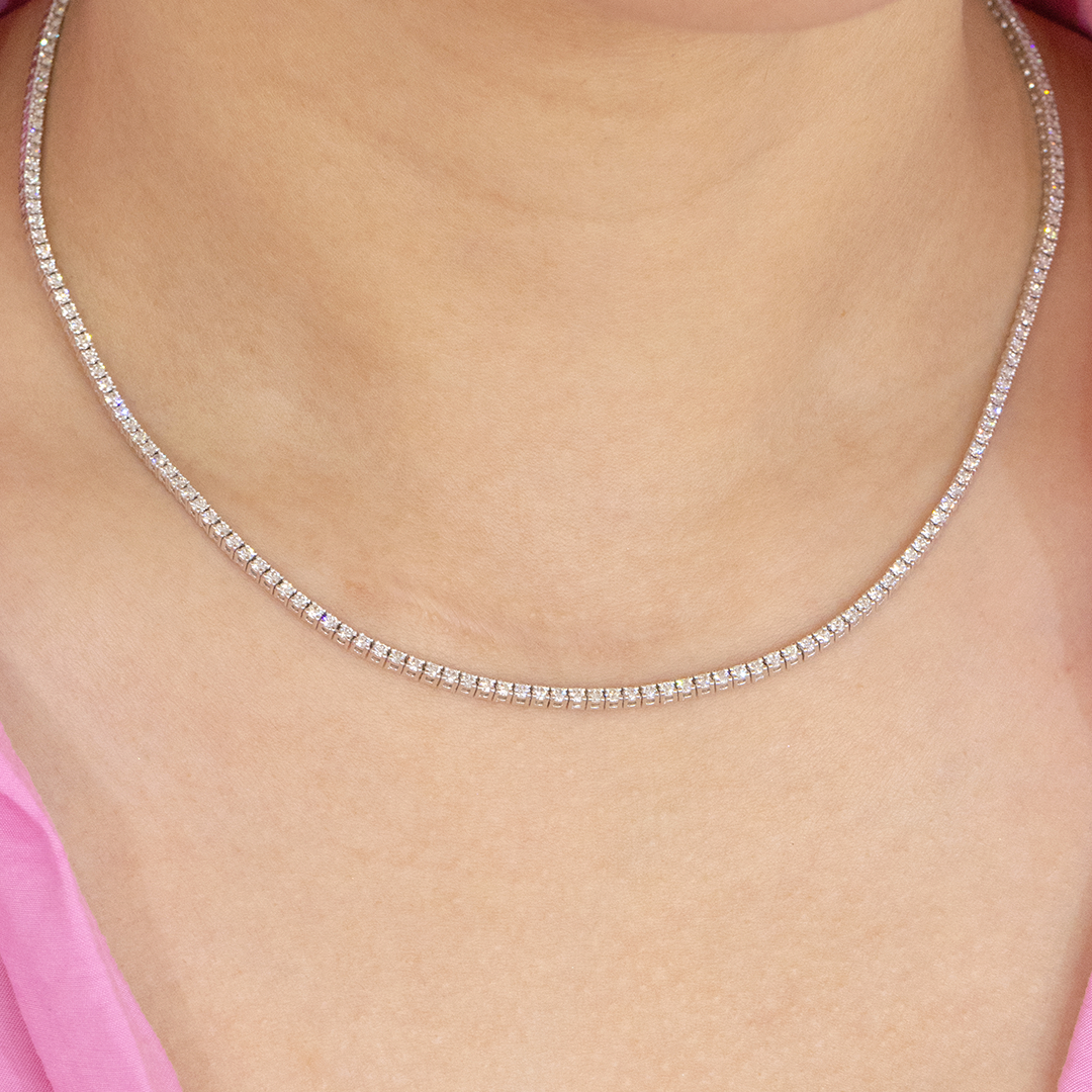 Choker worn on person, round diamonds, petite design.