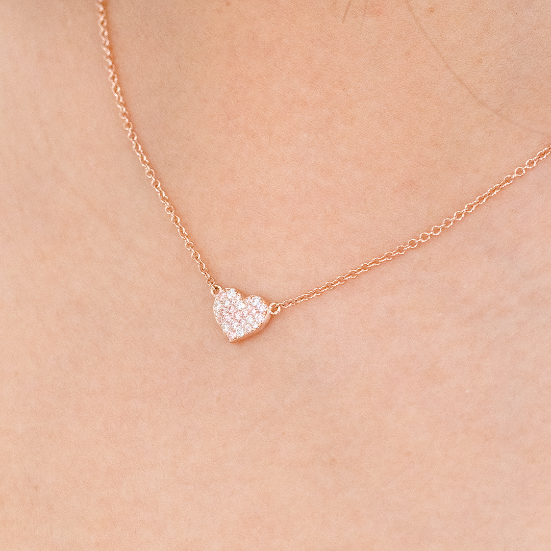 Rose gold necklace with pink diamond heart pendant.