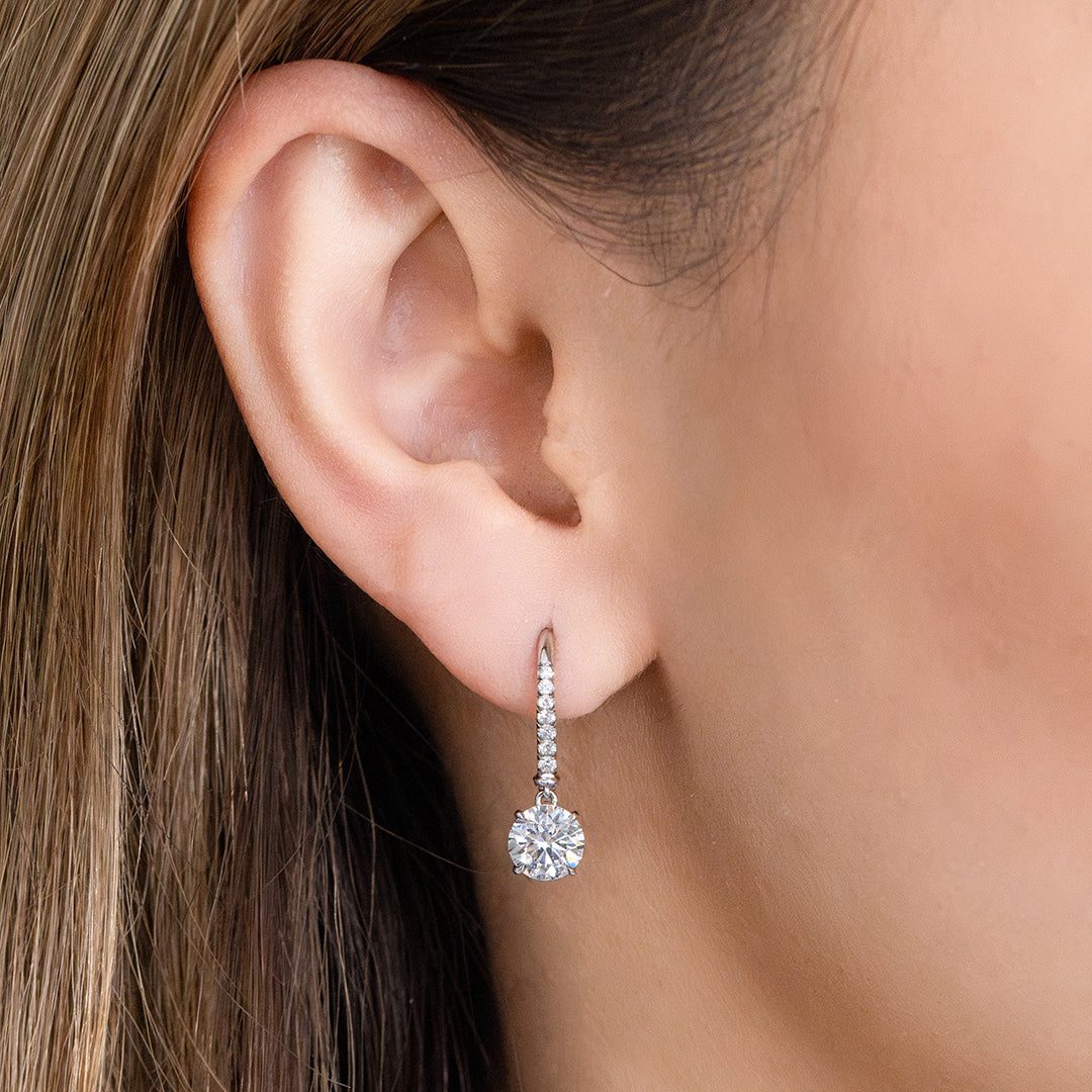 Diamond Dangle Earrings on Ear, White Gold, Lab Grown.